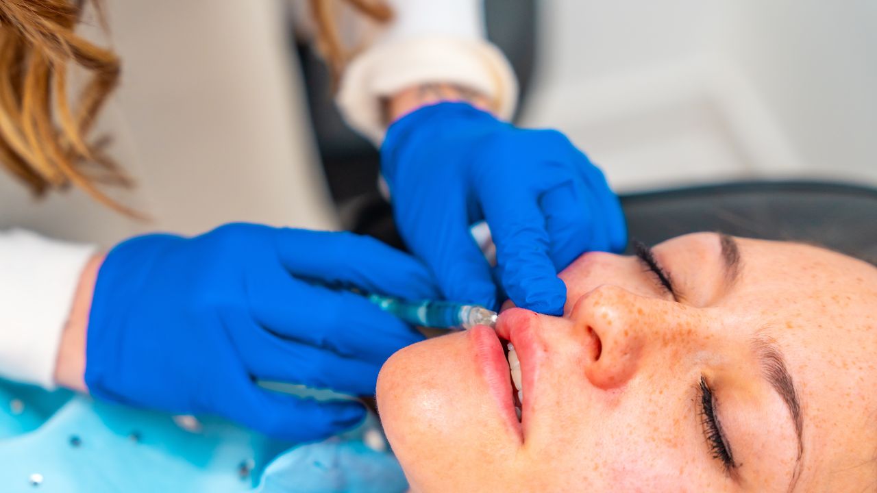 a woman getting lip fillers for uneven lips