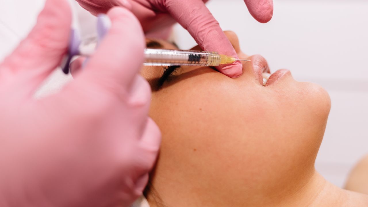 a woman getting lip fillers
