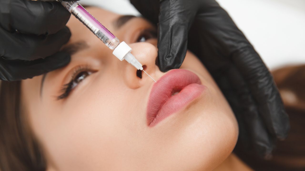 a girl receiving lip injections